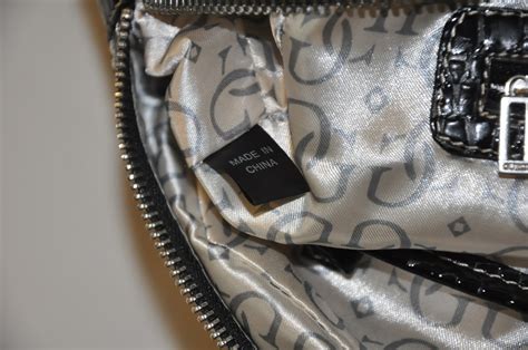 how do you spot a fake guess bag|guess bag genuine.